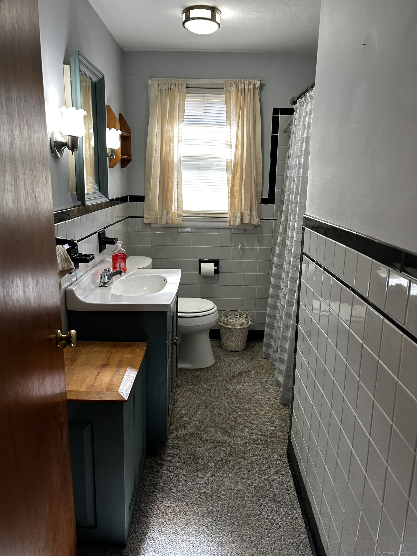 69 Wauregan Road Killingly, CT 06239 - Photo 21 of 23 a bathroom with a sink toilet and mirror