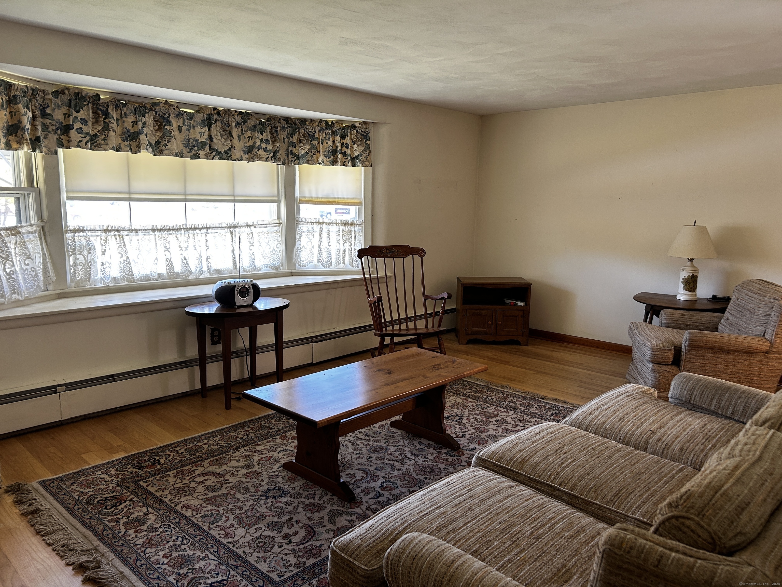 69 Wauregan Road Killingly, CT 06239 - Photo 5 of 23 a living room with furniture and a window