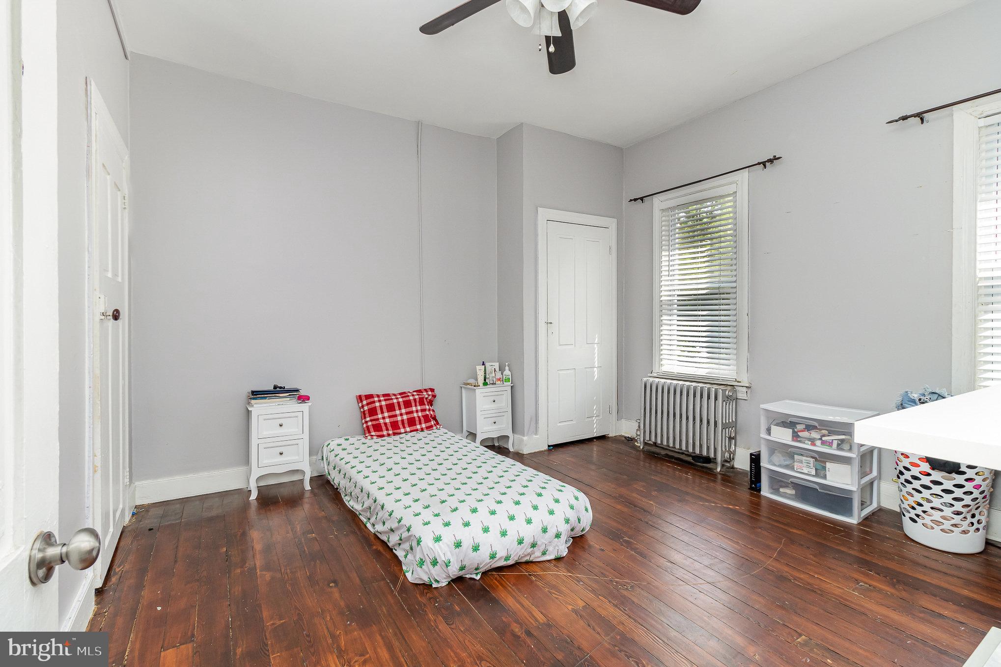 151 South Pershing Avenue York, PA 17401 - Photo 12 of 21 a bedroom with a bed and wooden floor