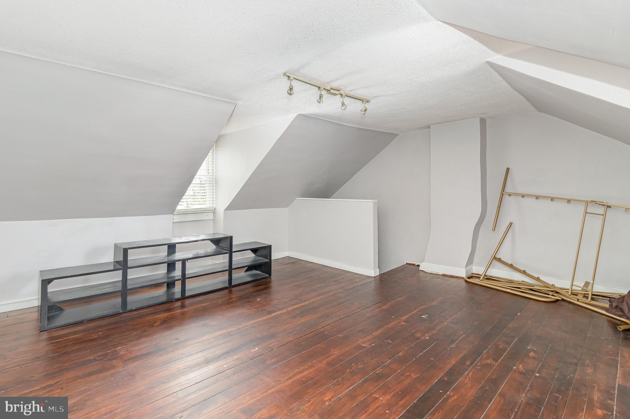 151 South Pershing Avenue York, PA 17401 - Photo 15 of 21 a view of an empty room with wooden floor and white walls