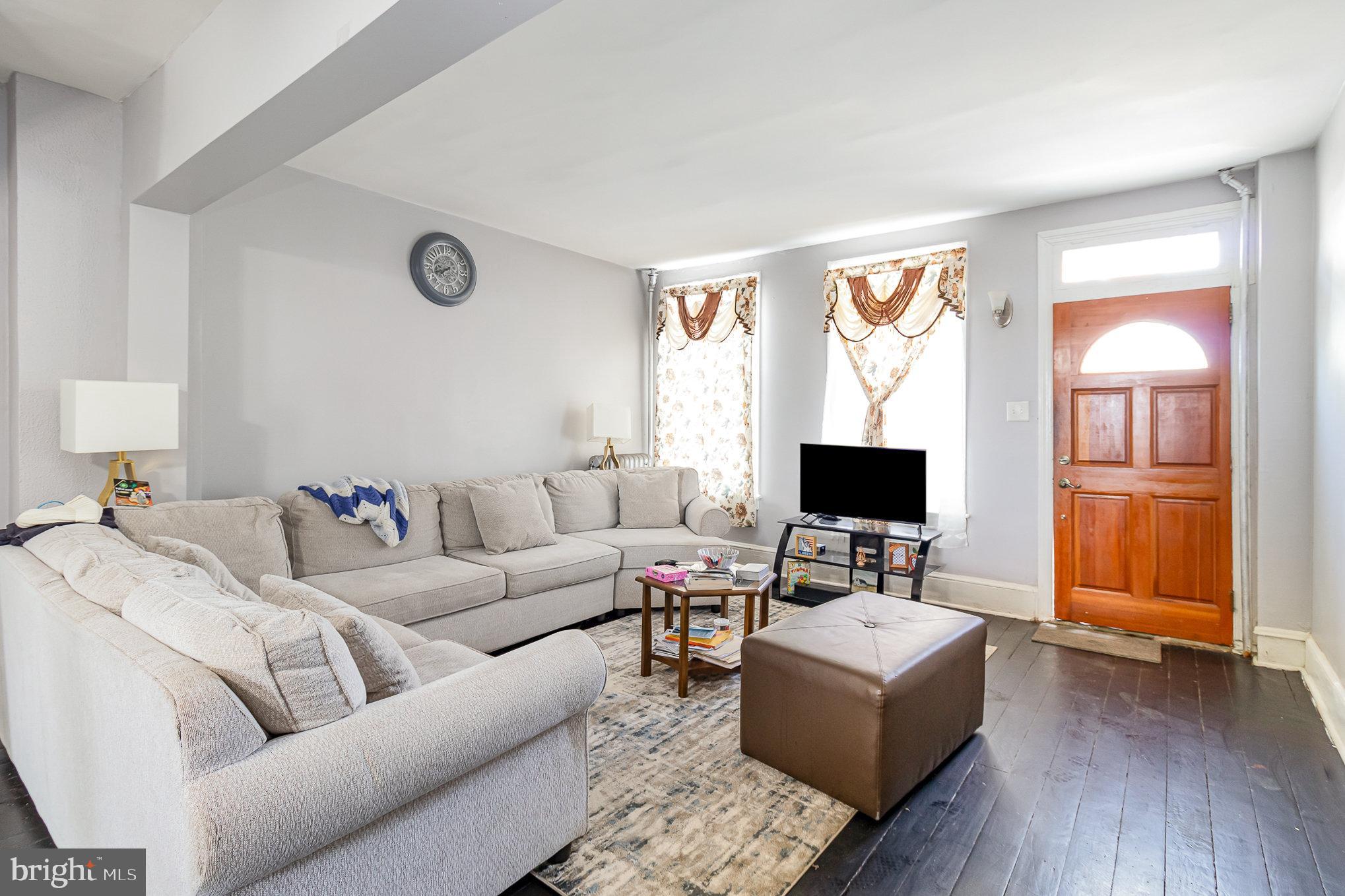 151 South Pershing Avenue York, PA 17401 - Photo 4 of 21 a living room with furniture and a flat screen tv