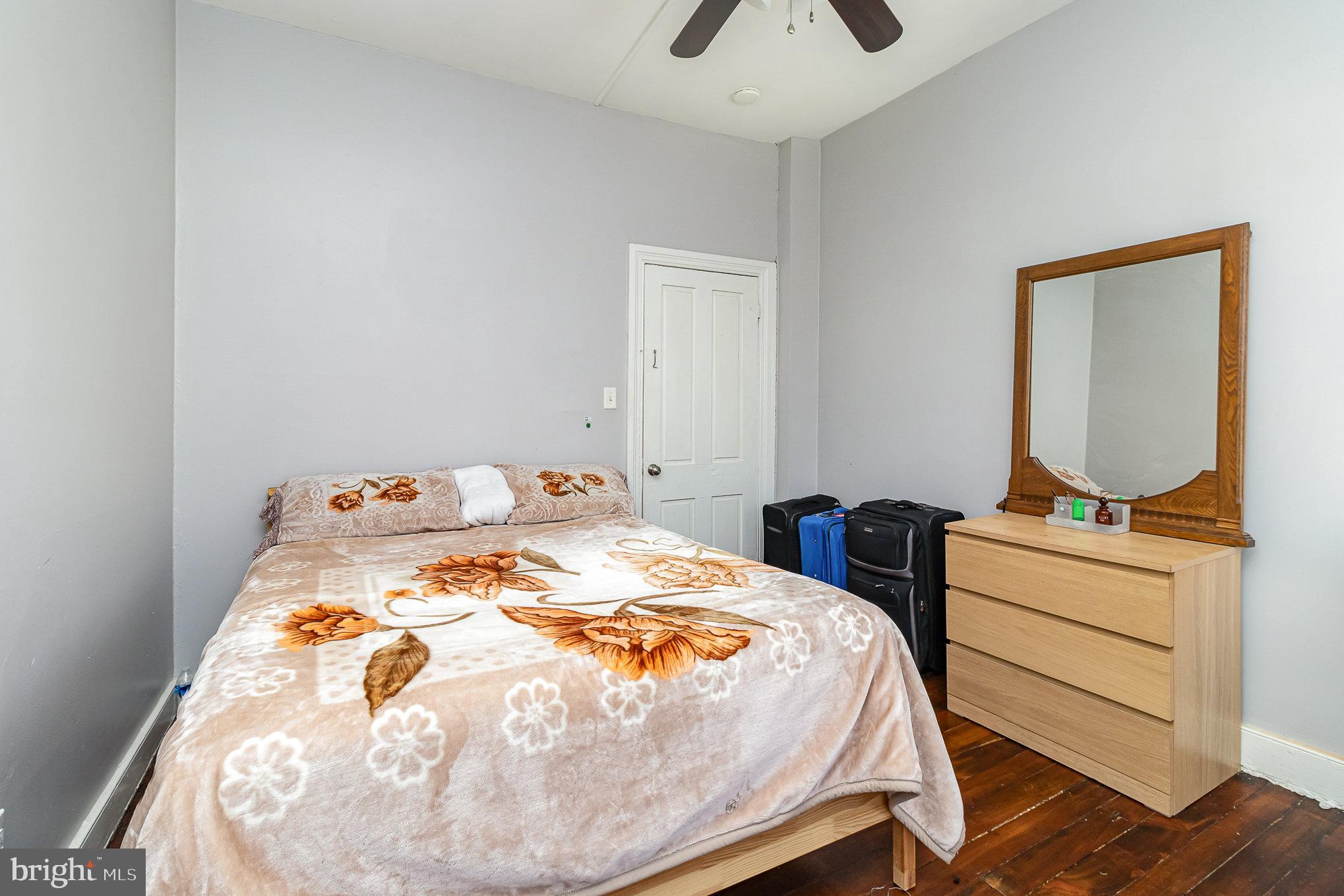 151 South Pershing Avenue York, PA 17401 - Photo 10 of 21 a bedroom with a bed and wooden floor