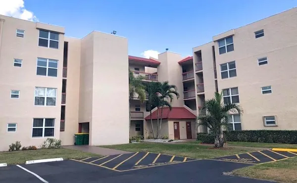 a view of a building with a yard