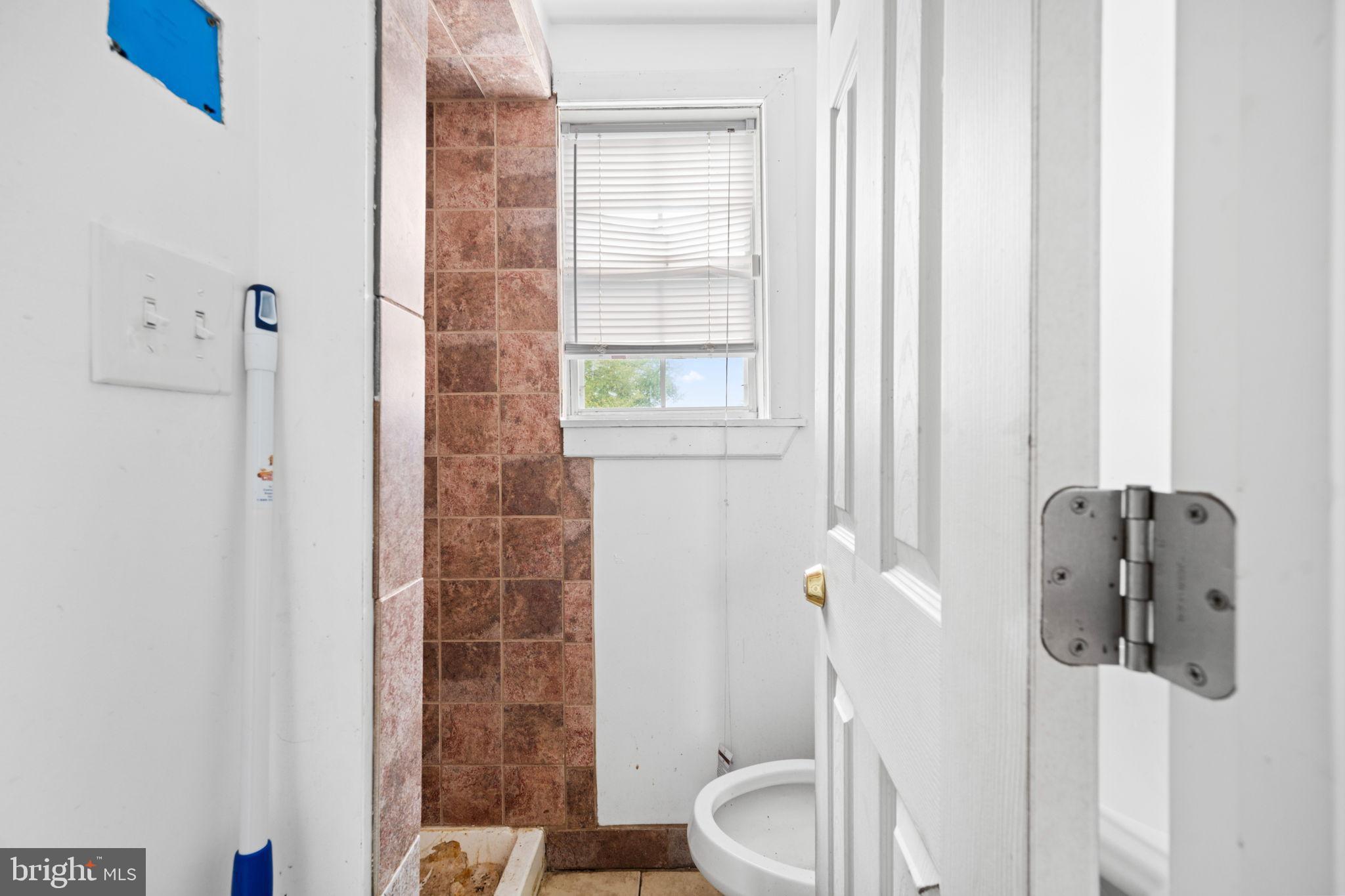 4227 Gault Place Northeast Washington, DC 20019 - Photo 17 of 34 Bright and airy bathroom with modern touches.