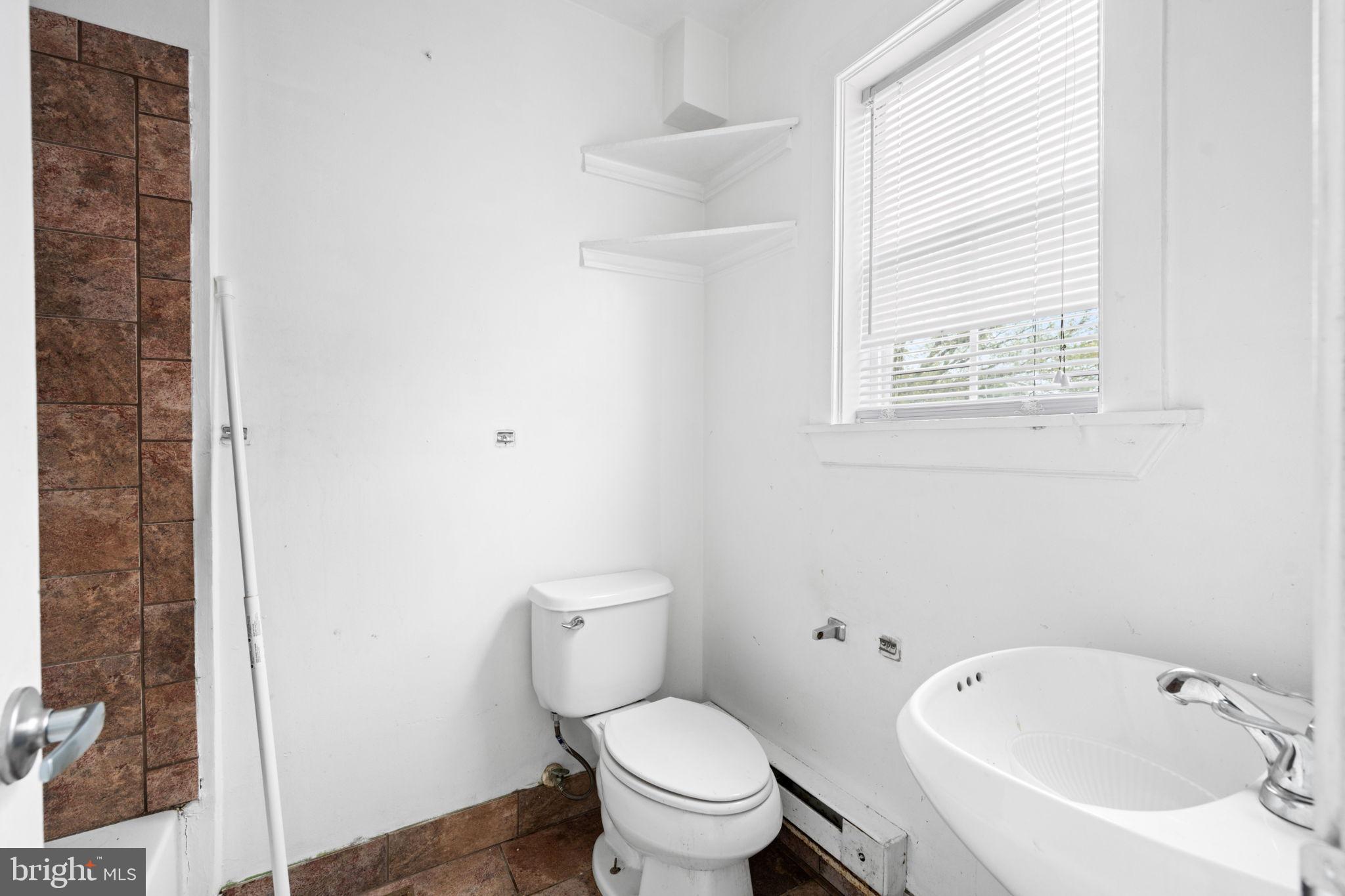 4227 Gault Place Northeast Washington, DC 20019 - Photo 18 of 34 Bright and airy bathroom with modern fixtures.