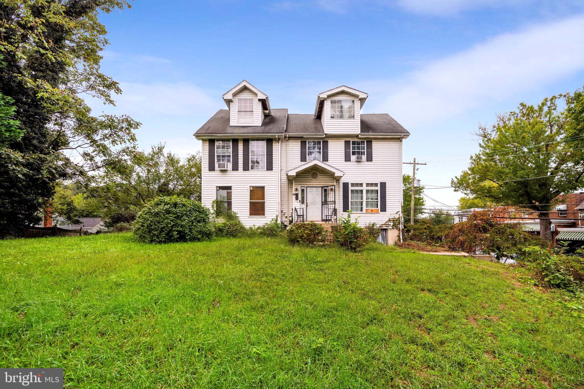 4227 Gault Place Northeast Washington, DC 20019 - Photo 2 of 34 Charming two-story home with lush greenery.