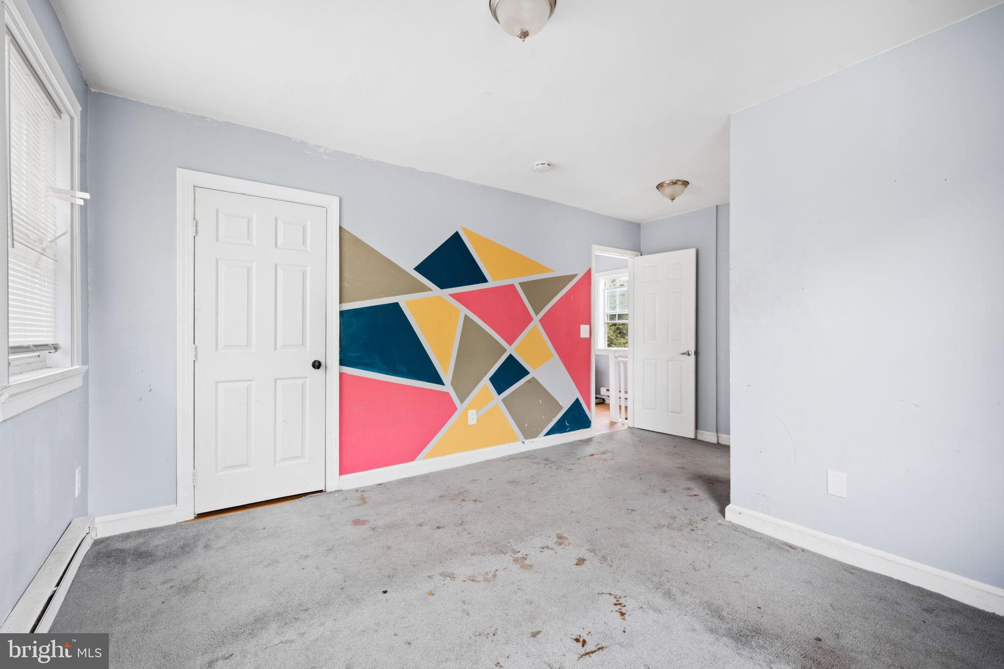 4227 Gault Place Northeast Washington, DC 20019 - Photo 23 of 34 Vibrant geometric wall adds character.