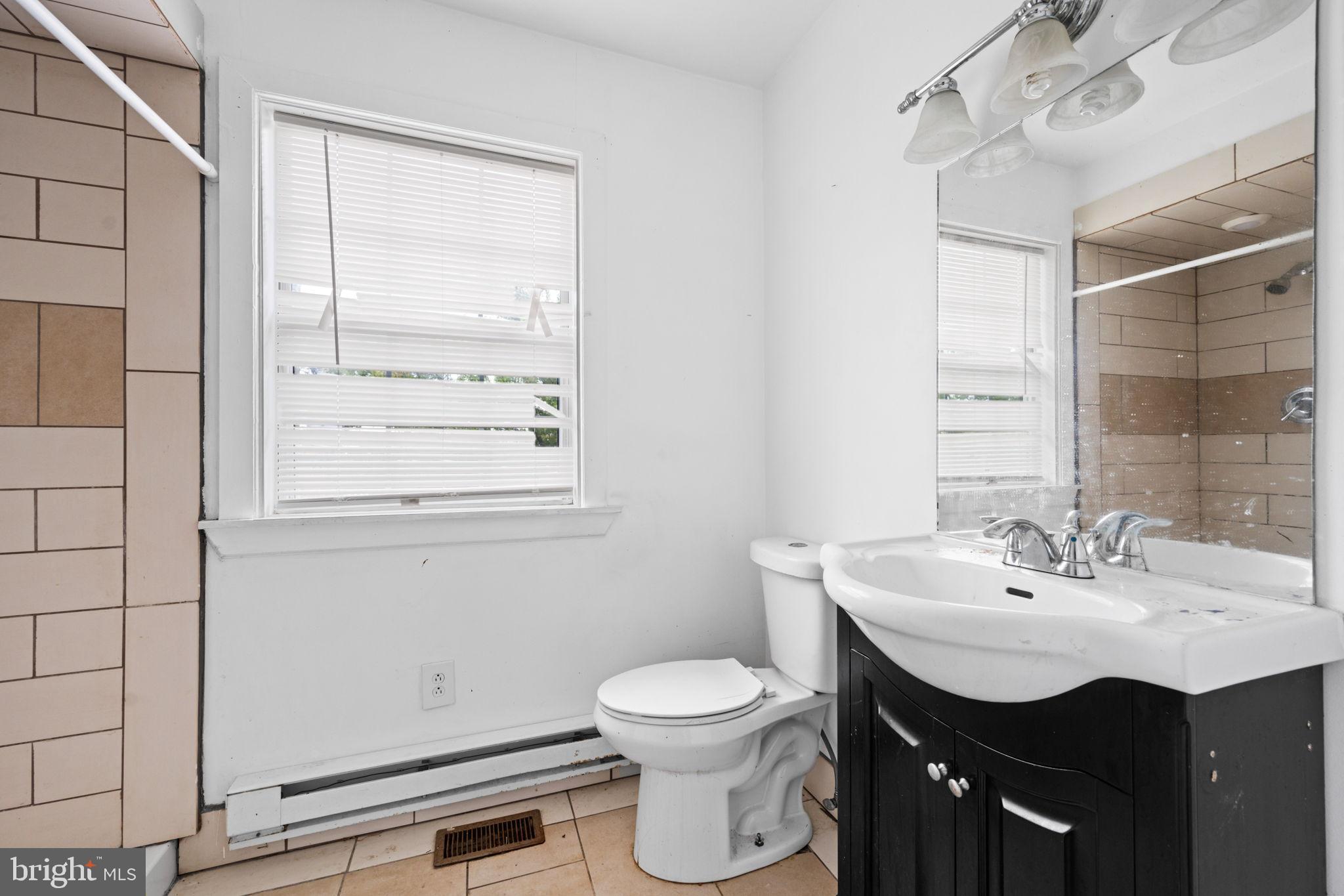 4227 Gault Place Northeast Washington, DC 20019 - Photo 24 of 34 Bright and airy bathroom with modern fixtures.