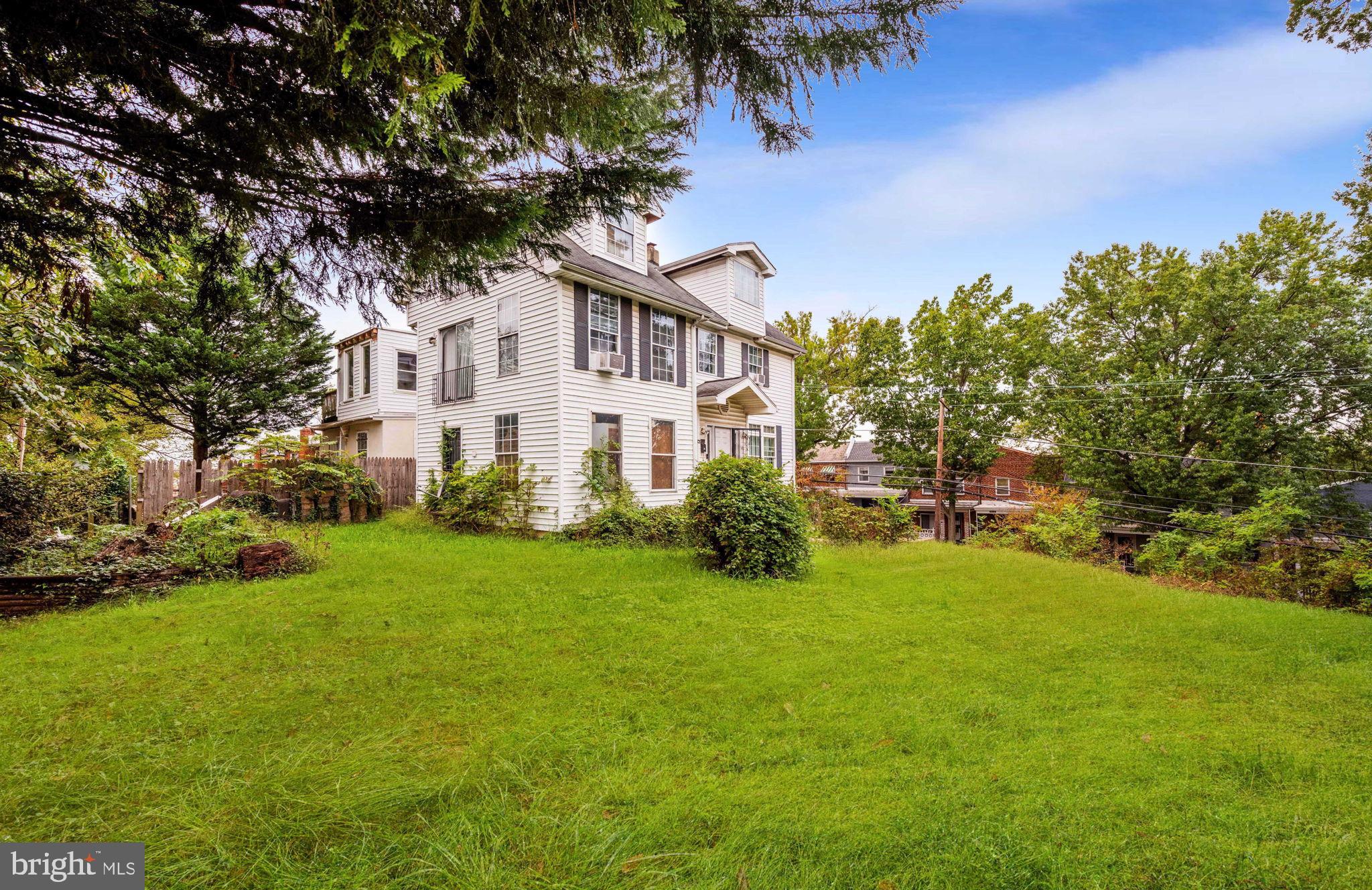 4227 Gault Place Northeast Washington, DC 20019 - Photo 4 of 34 Charming home nestled in lush greenery.