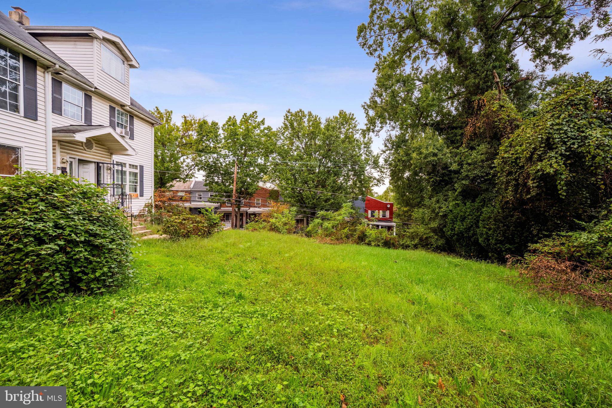 4227 Gault Place Northeast Washington, DC 20019 - Photo 5 of 34 Spacious green yard with serene surroundings.