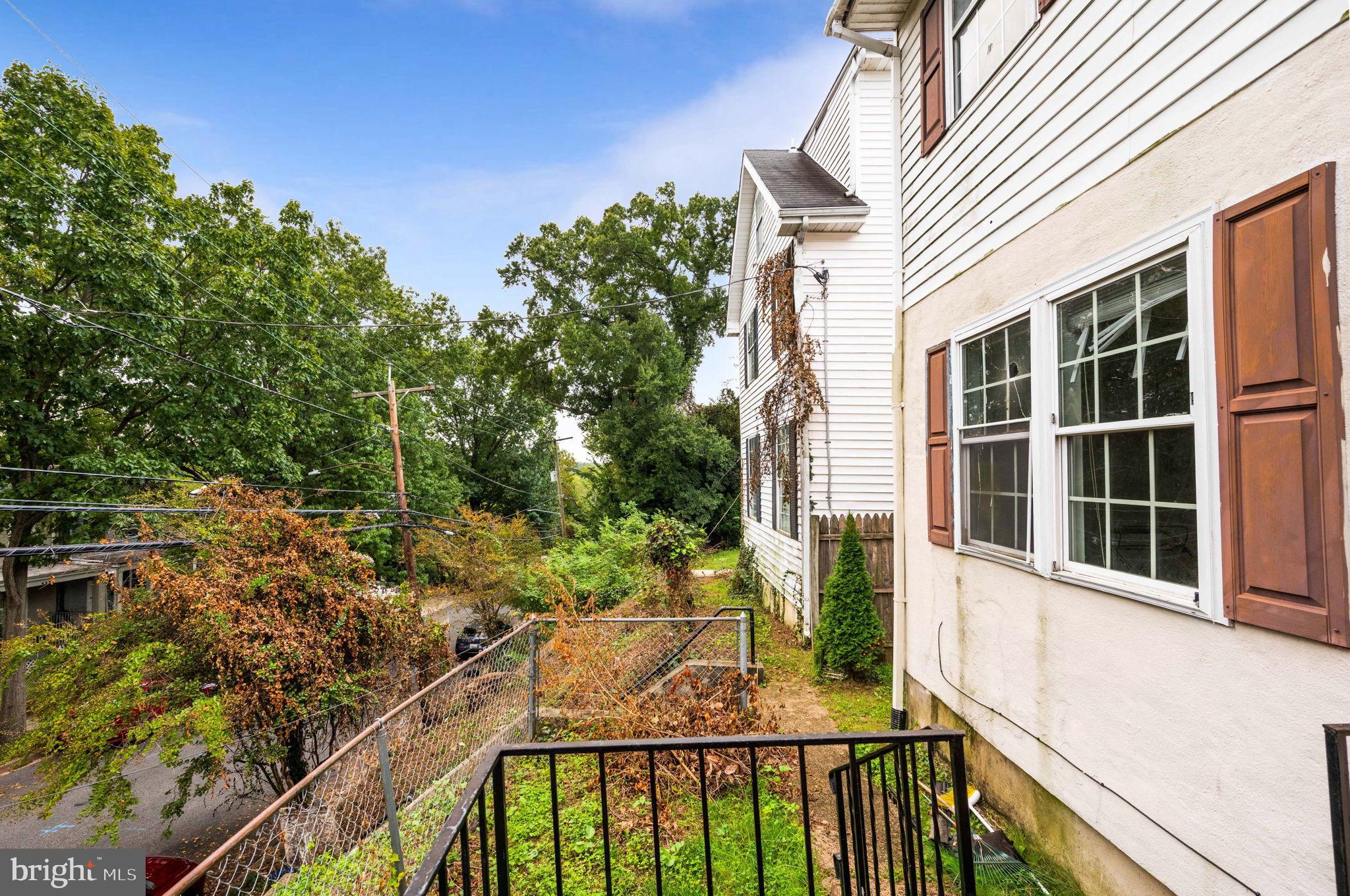 4227 Gault Place Northeast Washington, DC 20019 - Photo 6 of 34 Charming home with lush greenery backdrop.