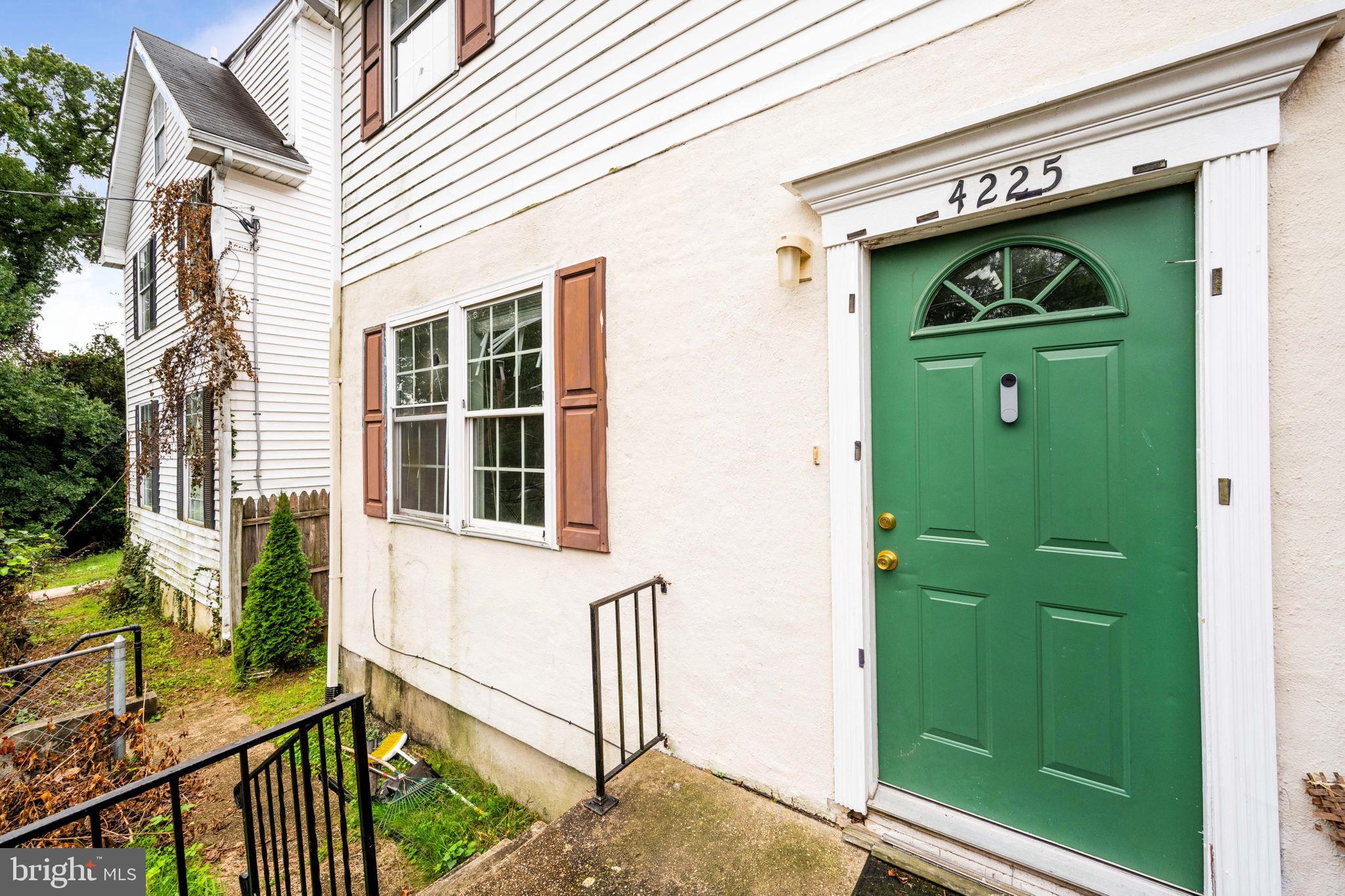 4227 Gault Place Northeast Washington, DC 20019 - Photo 7 of 34 Charming entrance with vibrant green door.