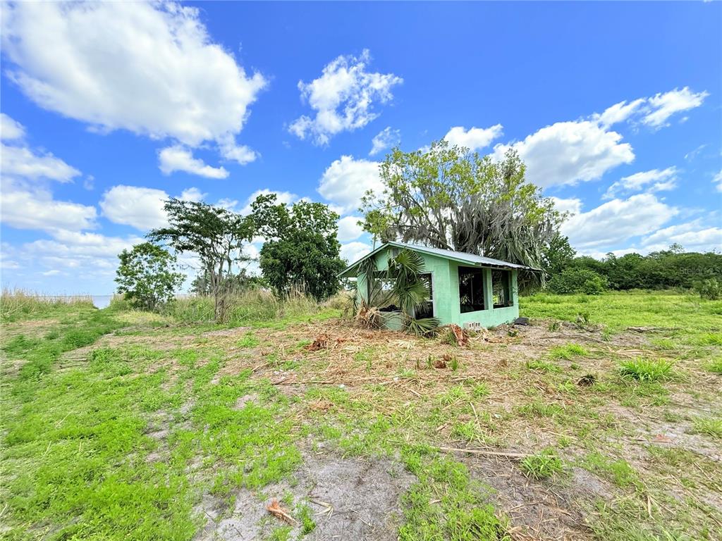 2170 Black Hammock Road Oviedo, FL 32765 - Photo 15 of 24 a white house that has a tree in it
