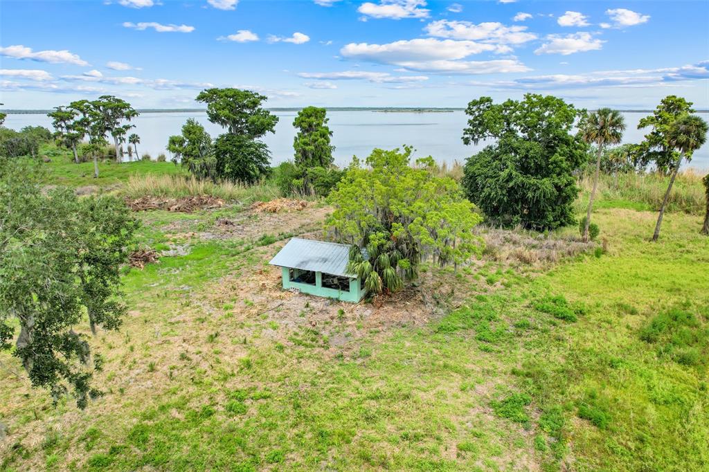 2170 Black Hammock Road Oviedo, FL 32765 - Photo 7 of 24 a backyard of a house with a yard and outdoor seating