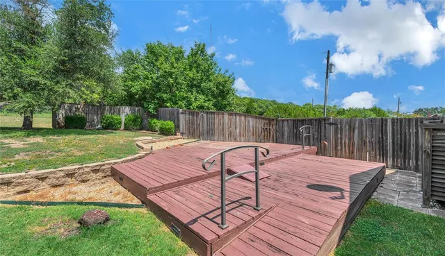 a view of a deck with furniture