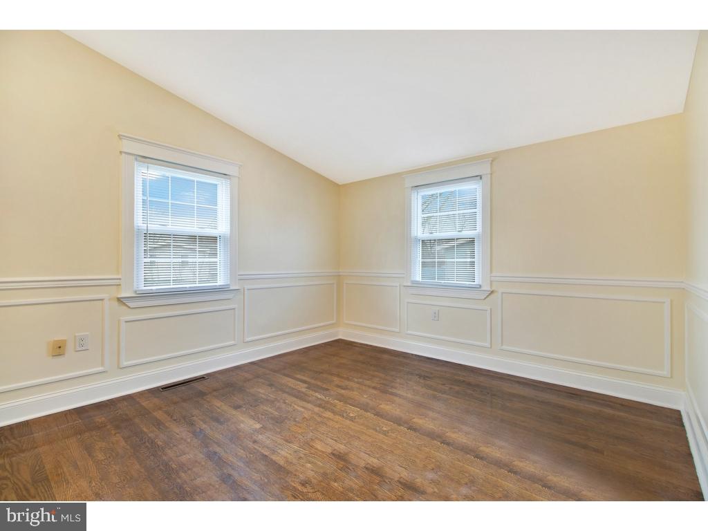 1101 Dorchester Road Newark, DE 19713 - Photo 10 of 19 a view of empty room with wooden floor and fan