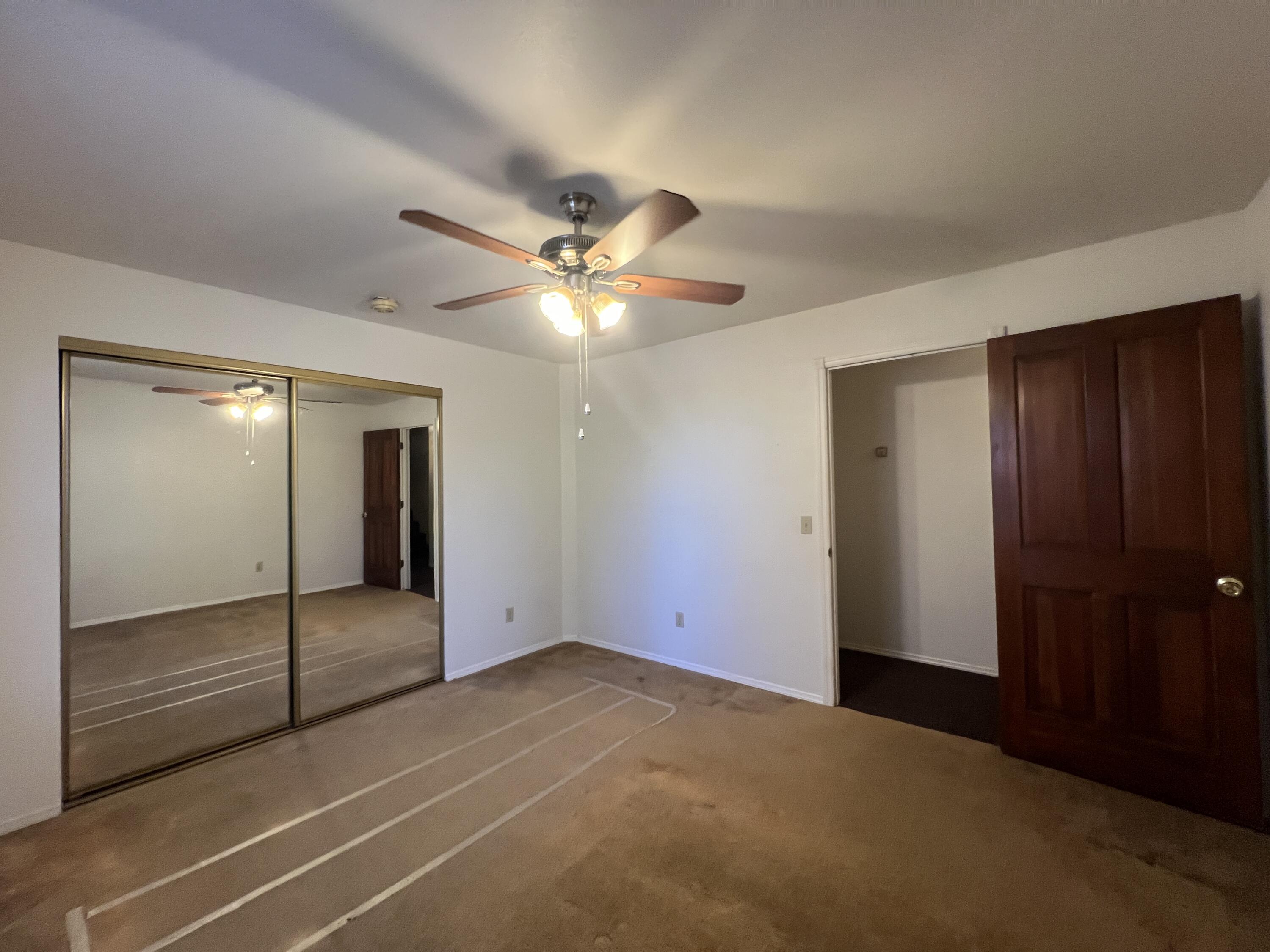 7582 Black Butte Road Shingletown, CA 96088 - Photo 12 of 25 a view of an empty room with a chandelier fan
