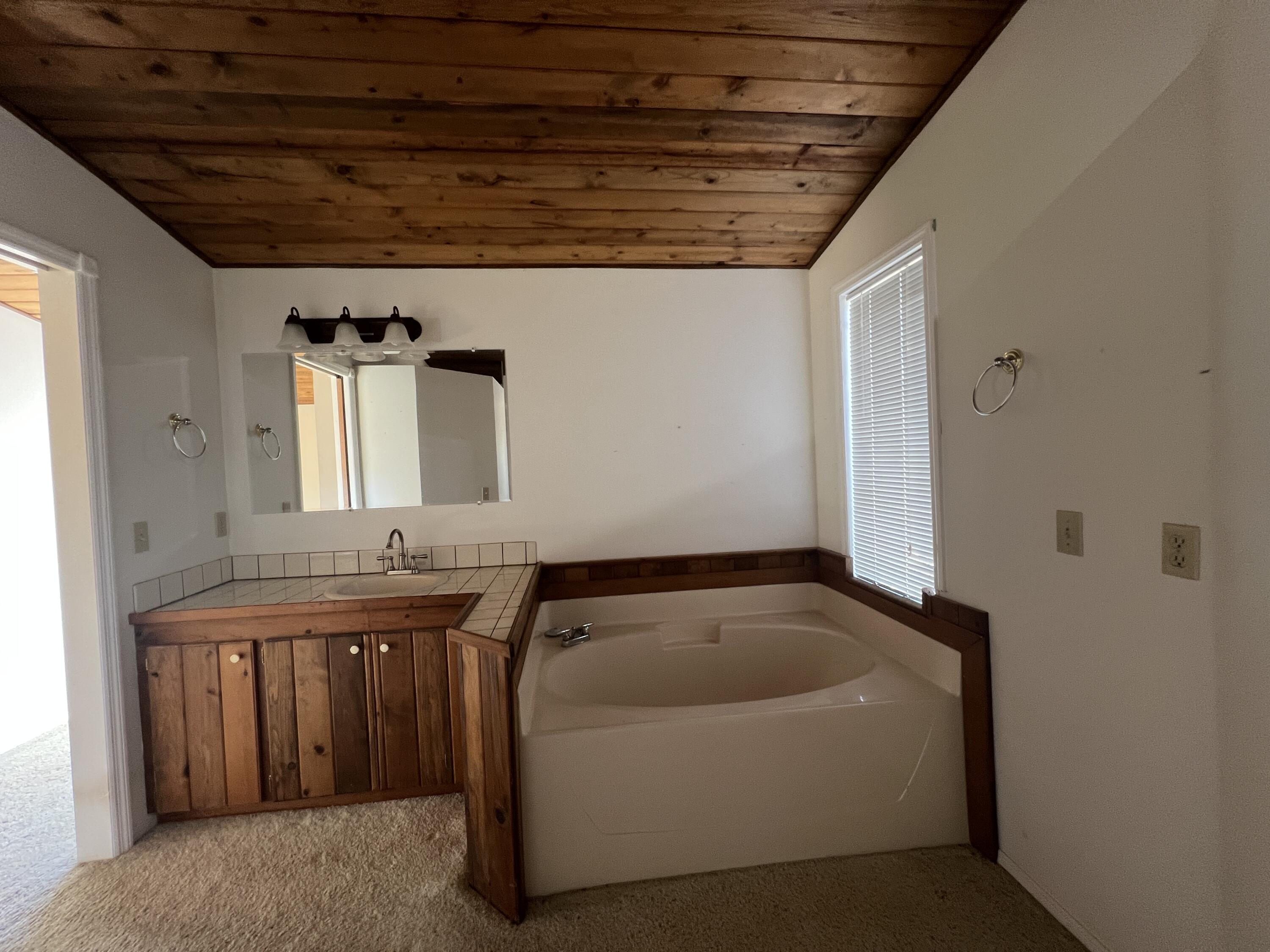 7582 Black Butte Road Shingletown, CA 96088 - Photo 15 of 25 a bathroom with a bathtub and sink