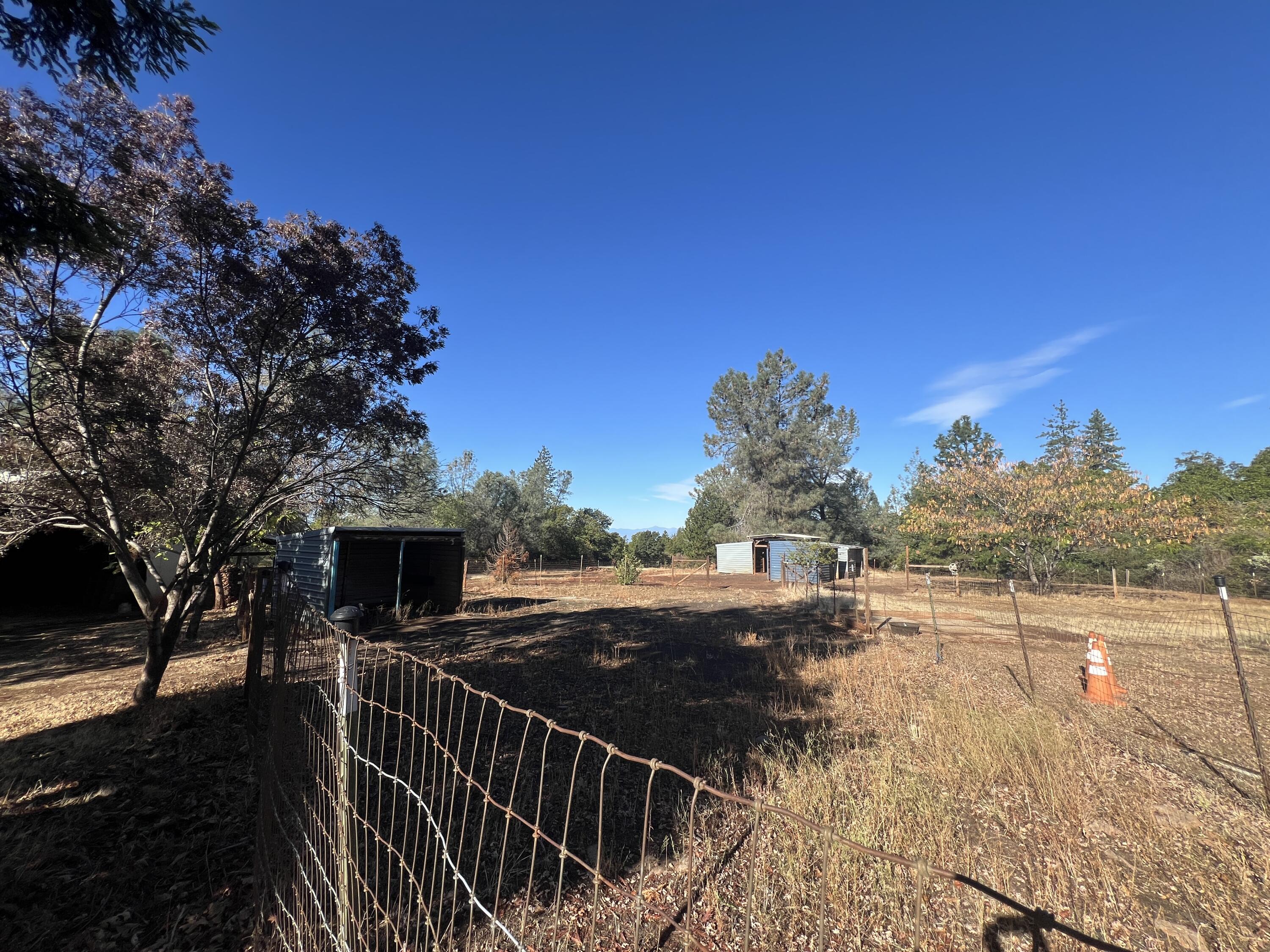 7582 Black Butte Road Shingletown, CA 96088 - Photo 20 of 25 a view of a pathway with a wrought fence