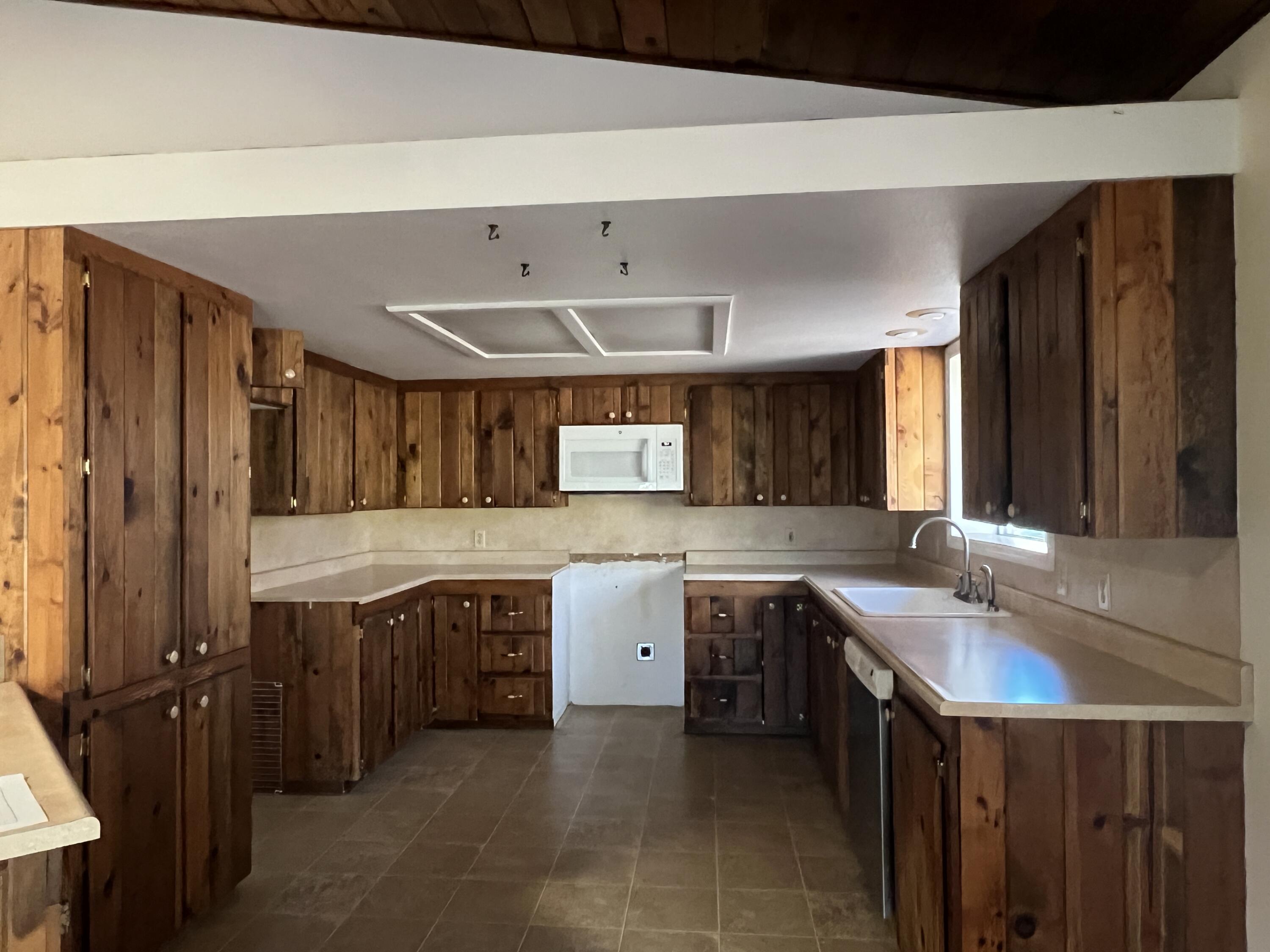 7582 Black Butte Road Shingletown, CA 96088 - Photo 3 of 25 a kitchen with a sink and cabinets