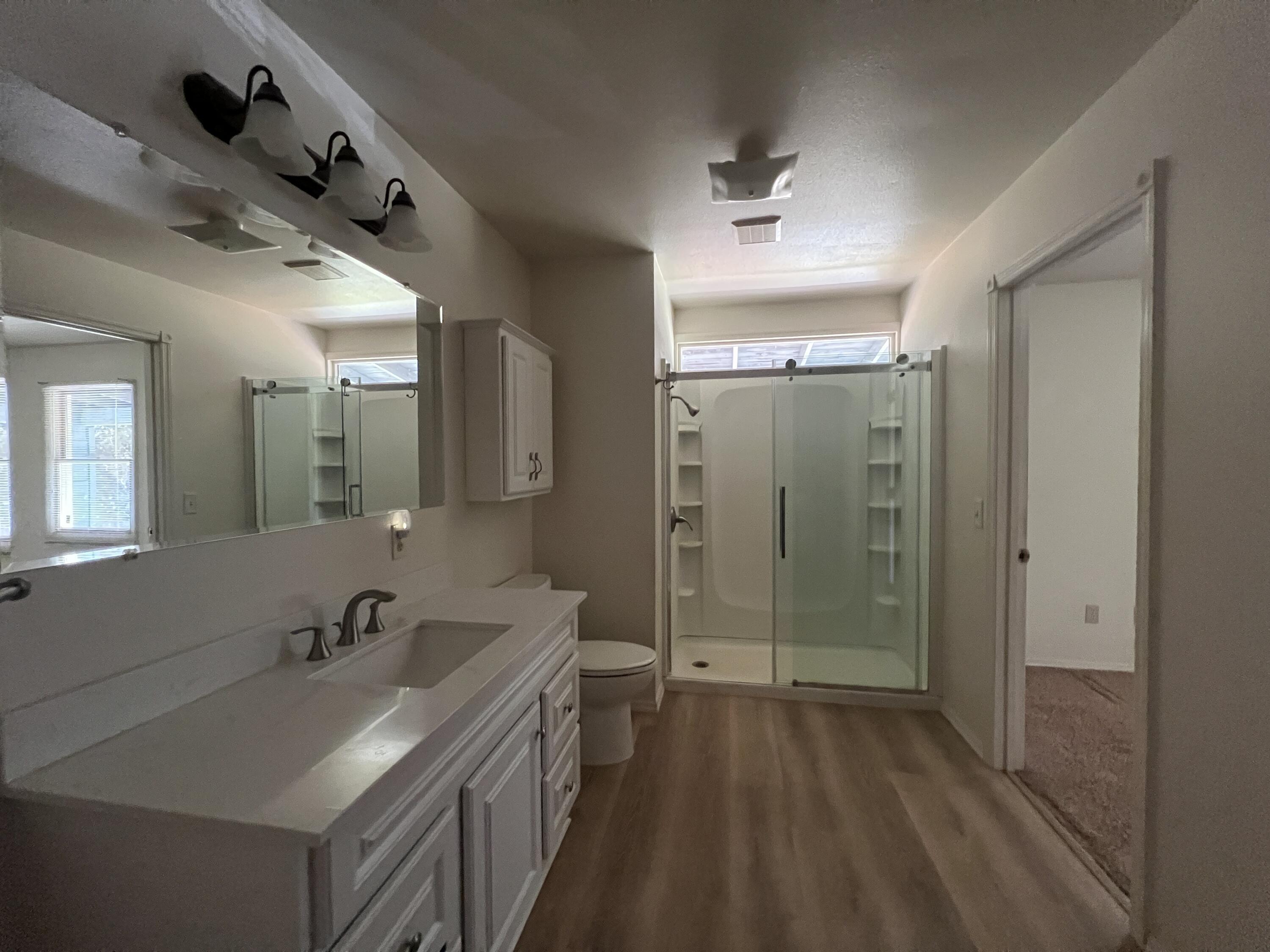 7582 Black Butte Road Shingletown, CA 96088 - Photo 7 of 25 a bathroom with a sink a toilet and shower