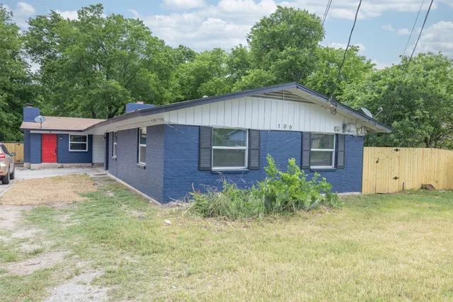 front view of a house with a street
