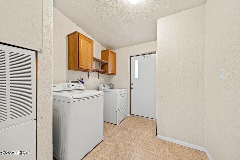 2421 West Thornton Road Show Low, AZ 85901 - Photo 27 of 48 a view of storage and utility room with washer and dryer