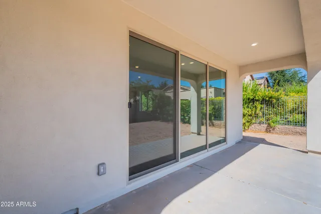 a view of an empty room with windows