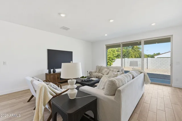 a living room with furniture and a large window