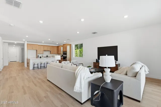 a living room with furniture and a table