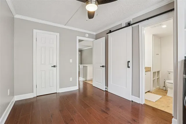 a view of an empty room and wooden floor