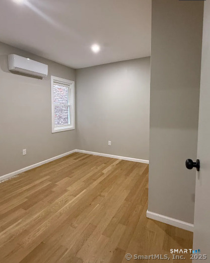 61 Field Street, Unit 106 Waterbury, CT 06702 - Photo 3 of 5 a view of an empty room with a window