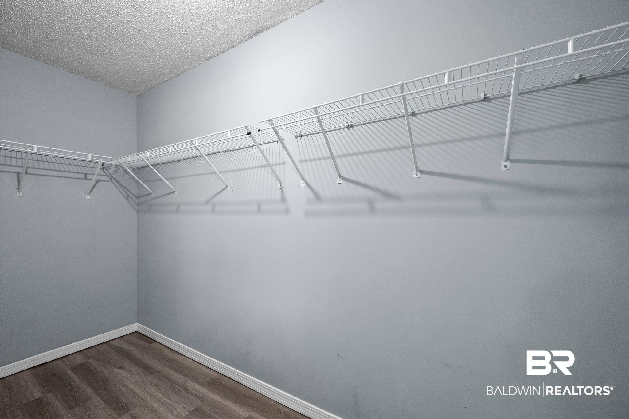 3744 Pepper Ridge Drive Mobile, AL 36693 - Photo 18 of 29 Spacious closet featuring dark wood finished floors