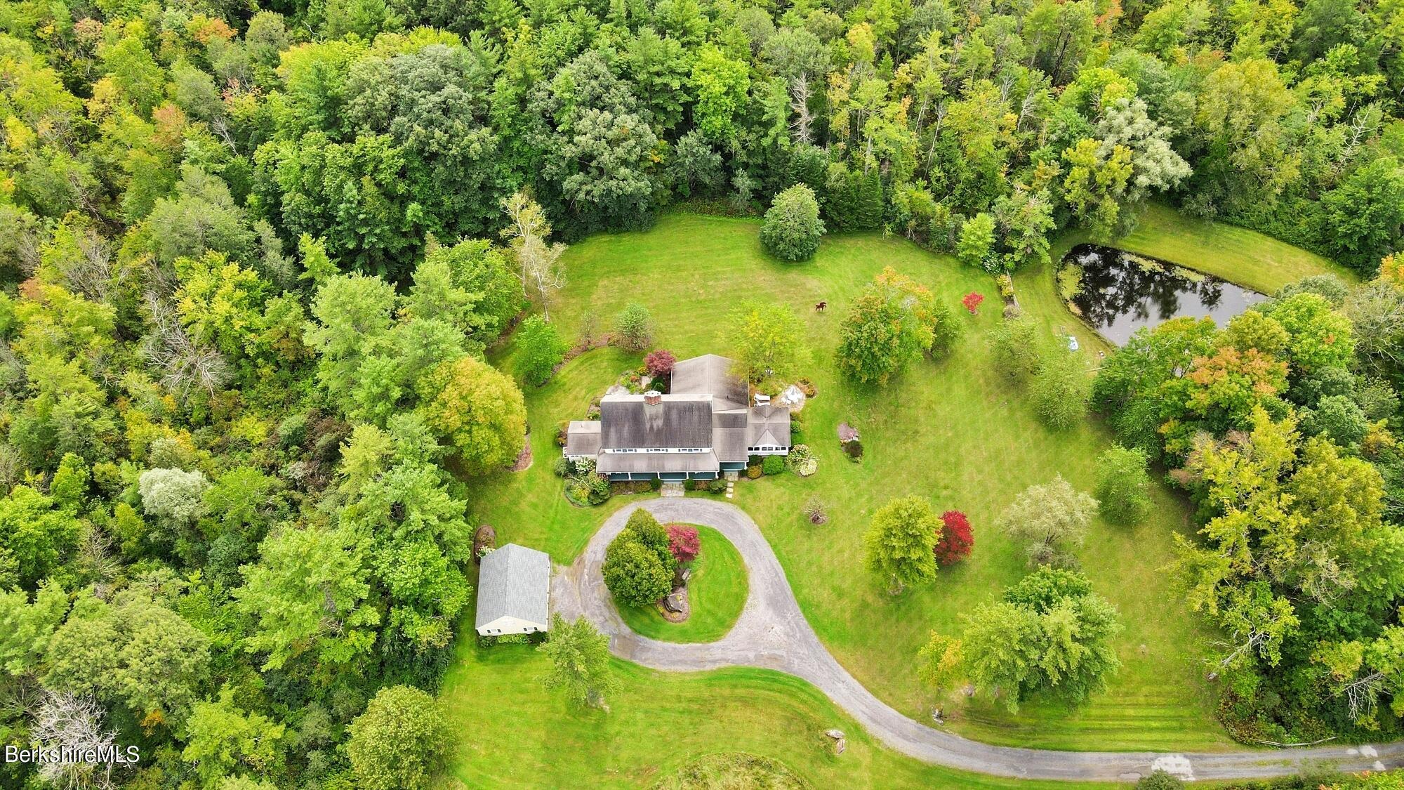 3 West Dale Road Stockbridge, MA 01229 - Photo 2 of 42 a backyard of a house with lots of green space