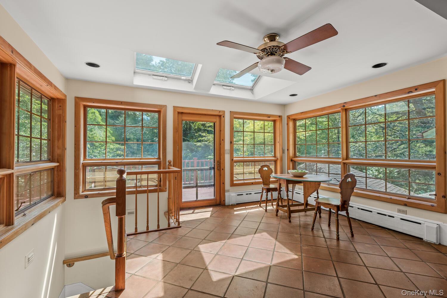 81 Glendale Road Ossining, NY 10562 - Photo 10 of 37 sunlight filled kitchen eating area, door to the deck and stairs to lower level