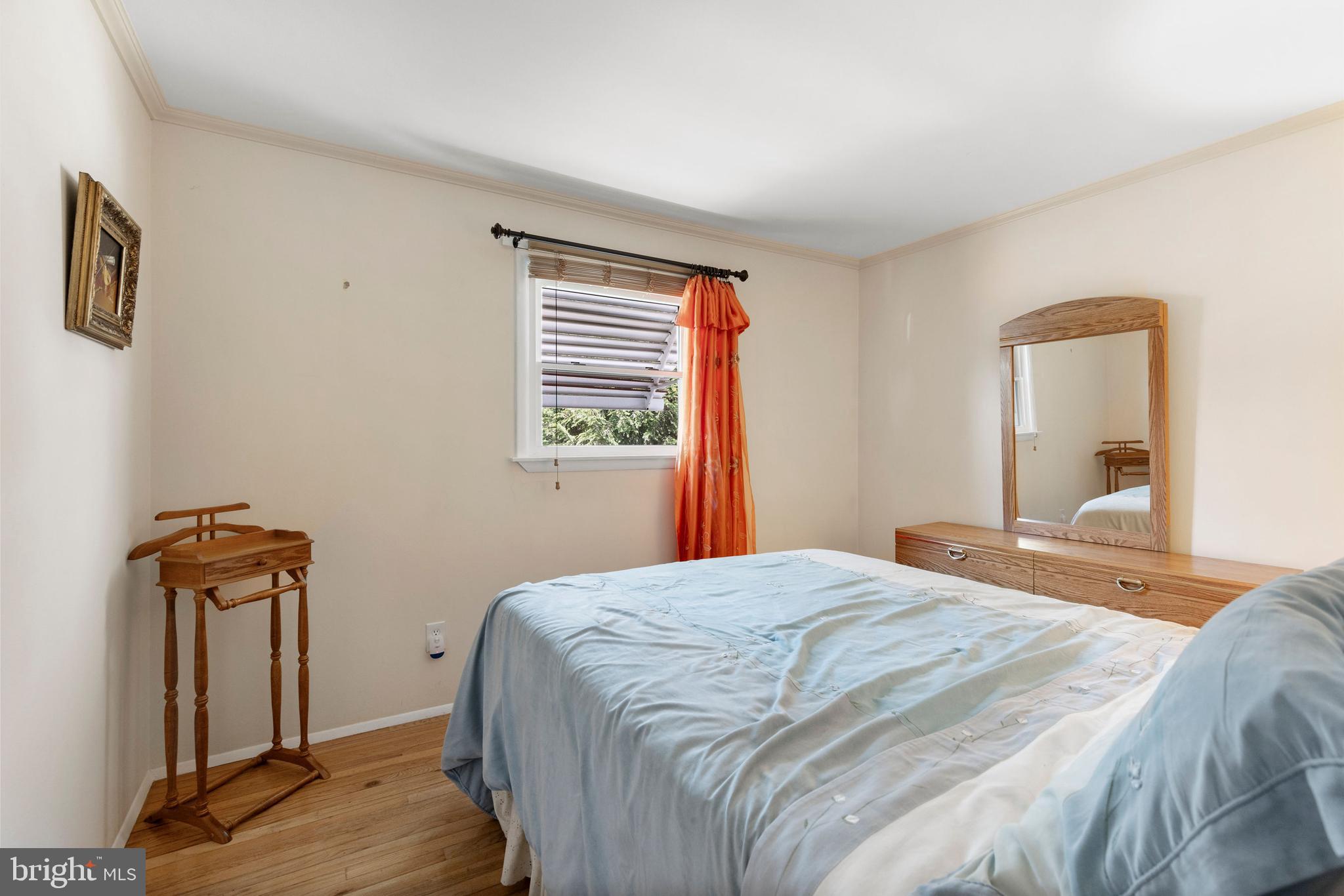1008 Rosedale Avenue Baltimore, MD 21237 - Photo 19 of 45 a bedroom with a bed and a mirror