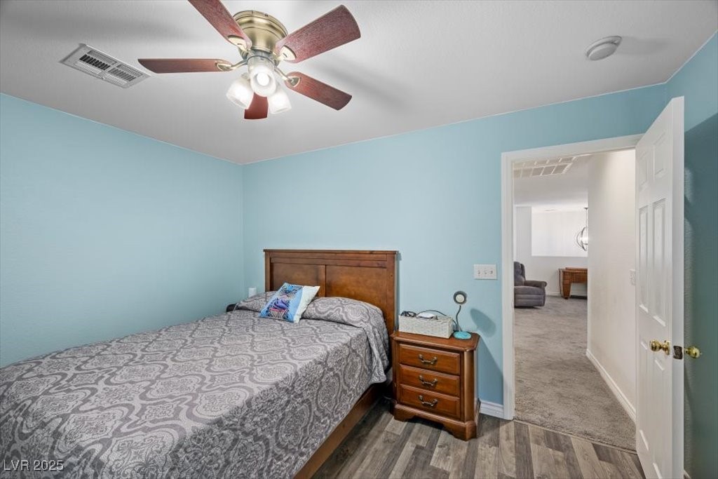 249 Cinnamon Ridge Way Henderson, NV 89015 - Photo 47 of 76 Bedroom with wood finished floors and a ceiling fan