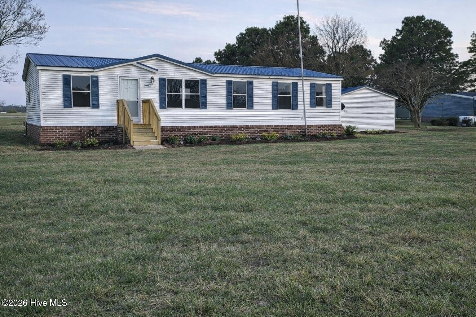 136 Deep Creek Road Hertford, NC 27944 - Photo 1 of 1 virtually staged with brick skirting