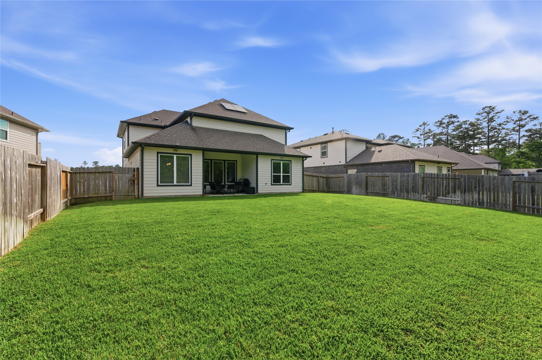 14108 Redfish Lake Conroe, TX 77384 - Photo 27 of 37 a front view of a house with a garden