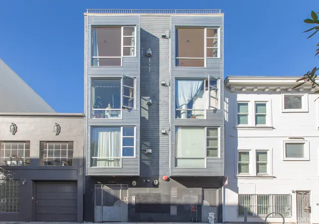 a front view of a building with many windows
