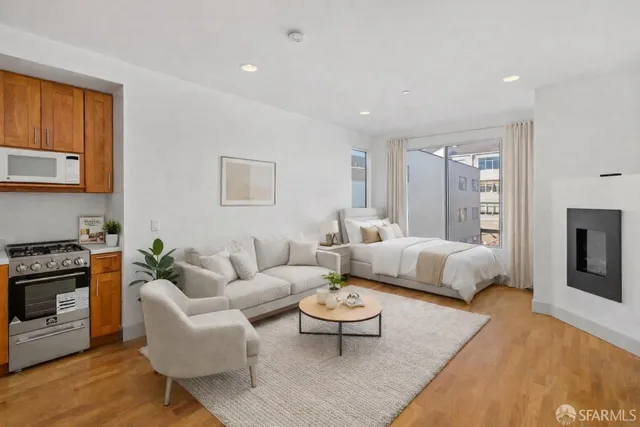 a living room with furniture and a fireplace