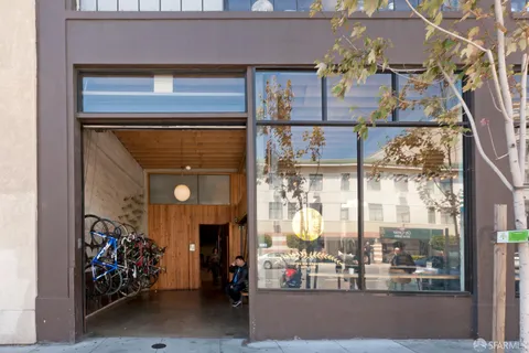 a variety of fruits and vegetables with building in the background