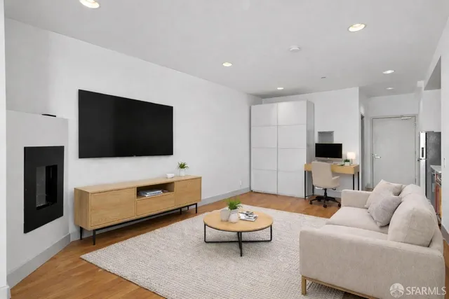 a living room with furniture and a flat screen tv