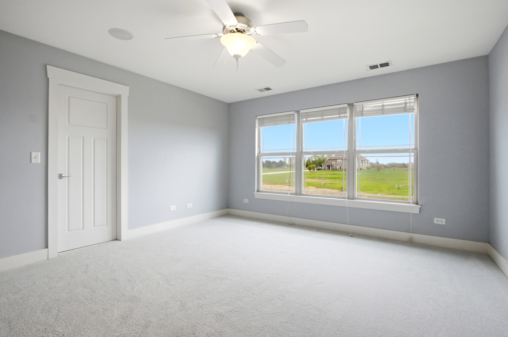15749 West Crobally Way Manhattan, IL 60442 - Photo 11 of 24 a view of an empty room with a window