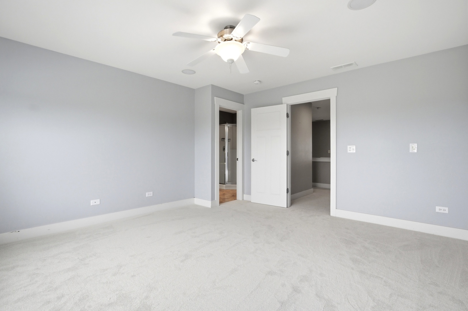 15749 West Crobally Way Manhattan, IL 60442 - Photo 12 of 24 a view of an empty room with a ceiling fan
