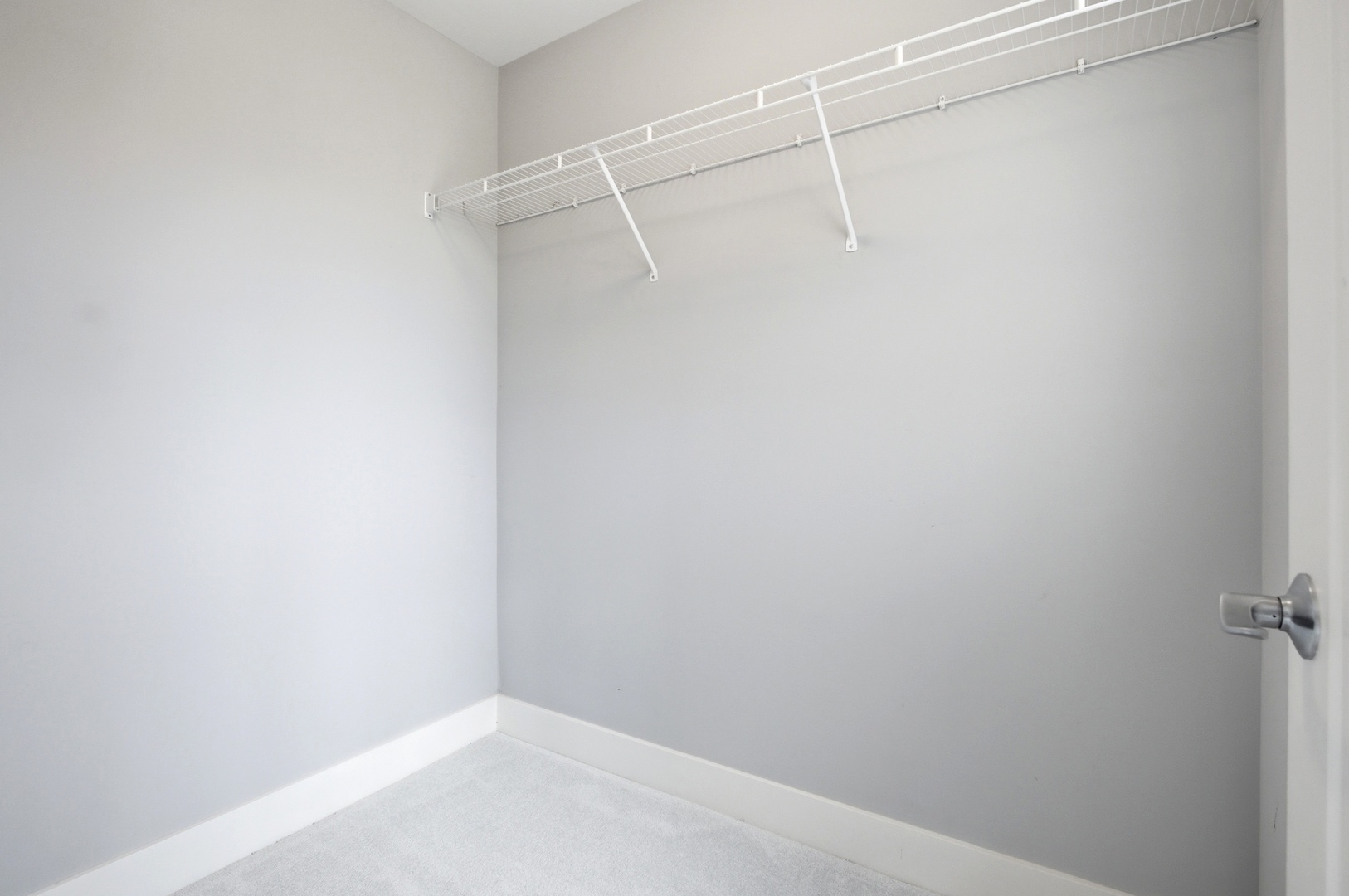 15749 West Crobally Way Manhattan, IL 60442 - Photo 17 of 24 a view of a room with racks on the wall