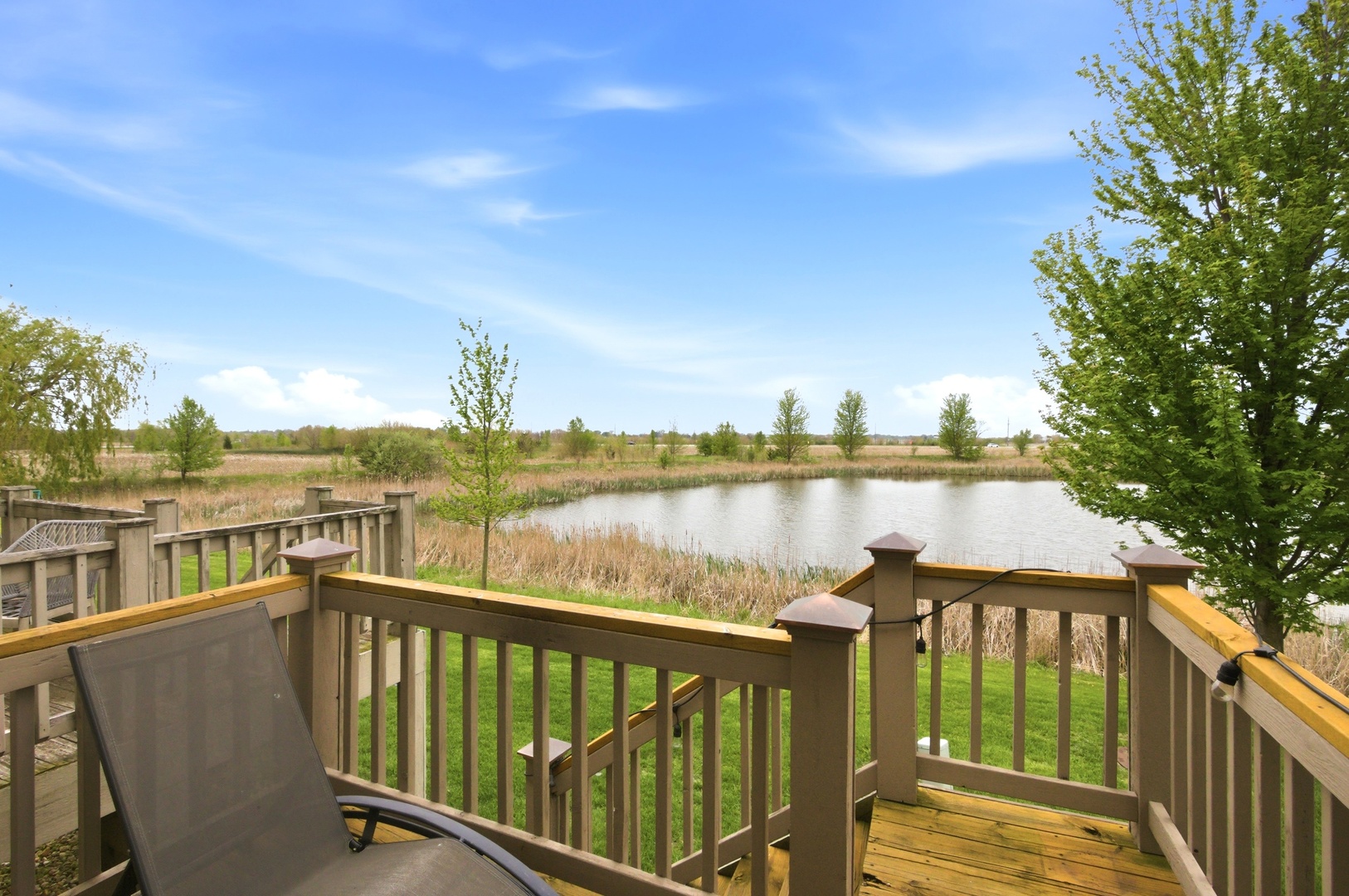 15749 West Crobally Way Manhattan, IL 60442 - Photo 24 of 24 a view of a lake from a balcony with outdoor space
