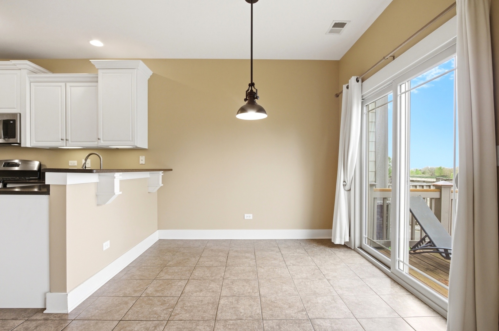 15749 West Crobally Way Manhattan, IL 60442 - Photo 6 of 24 a view of a kitchen with a sink and dishwasher wooden floor