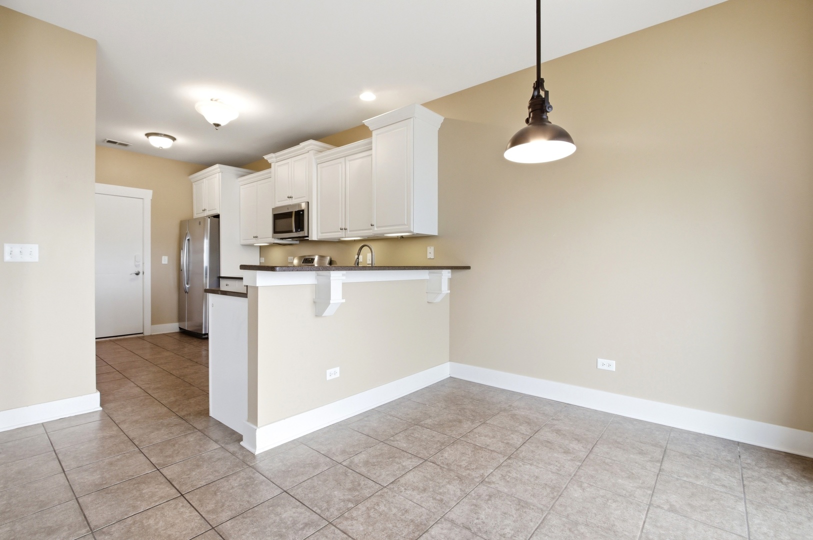 15749 West Crobally Way Manhattan, IL 60442 - Photo 7 of 24 a view of a kitchen with electric appliances
