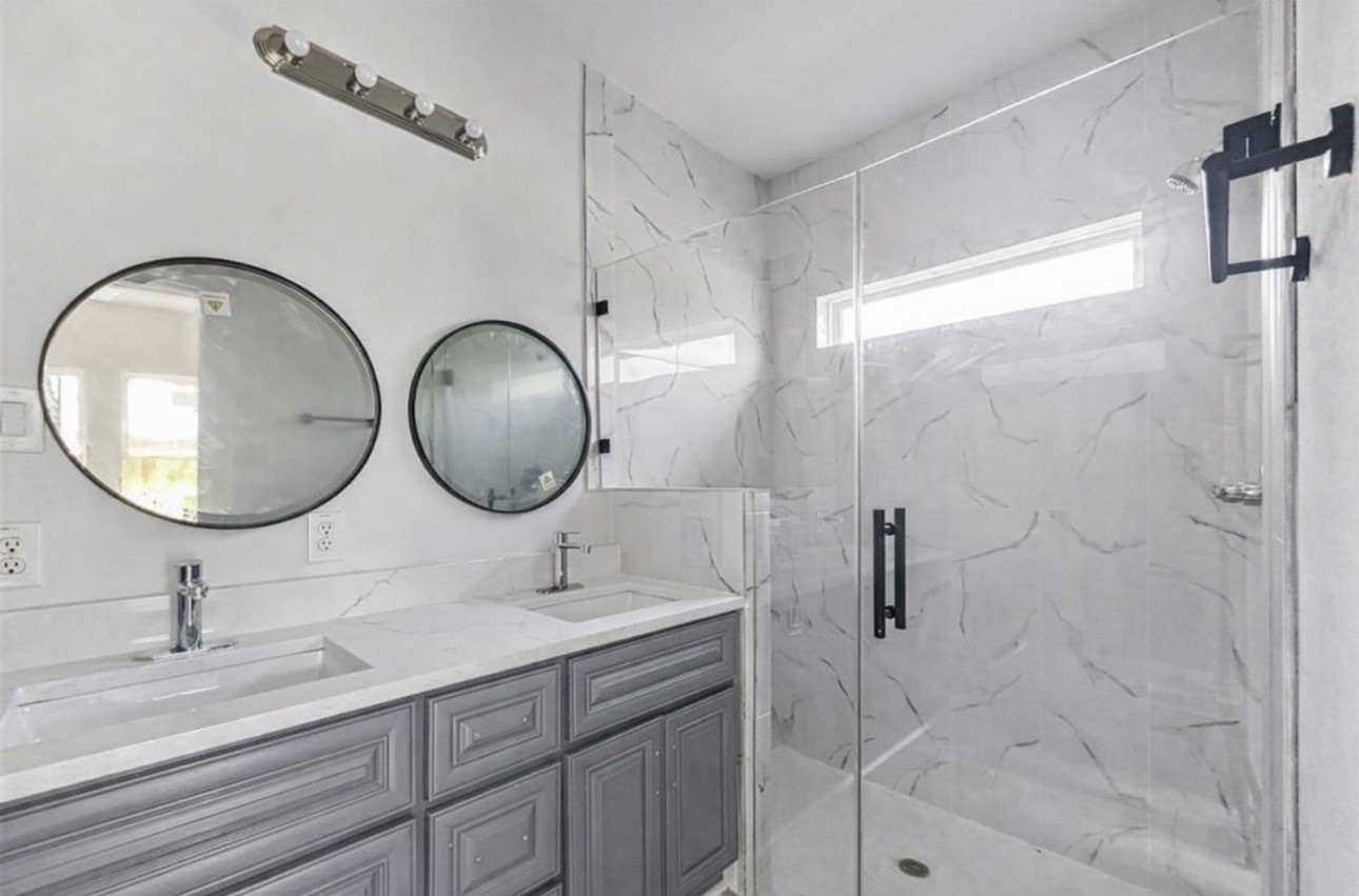 6010 Bobby Burns Street Houston, TX 77028 - Photo 11 of 22 a bathroom with a sink mirror and vanity